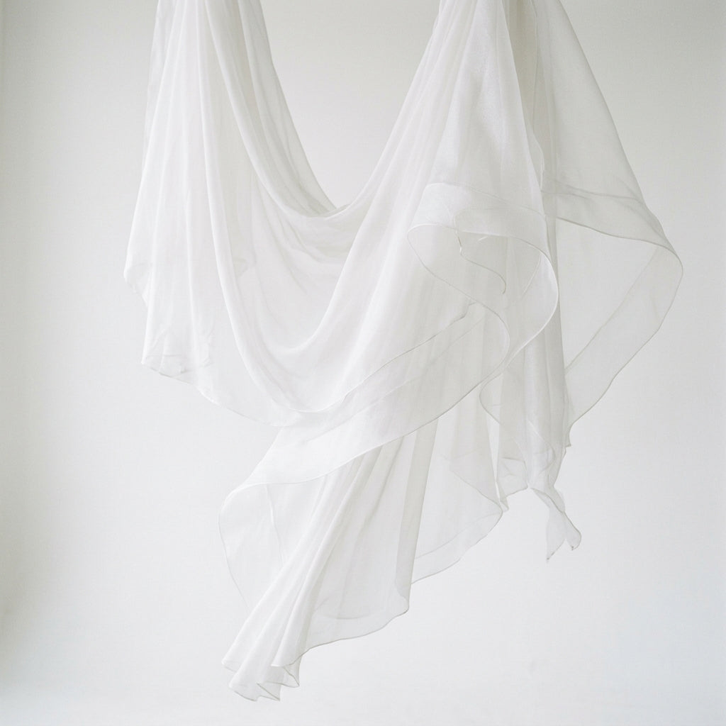 Light chiffon and crisp organza fabric layers for bridal gown comparison